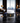 A jar of Ferraux Clay Mask for Pores & Blackheads, set on a polished black marble countertop with a blurred luxury living room background featuring a city skyline.
